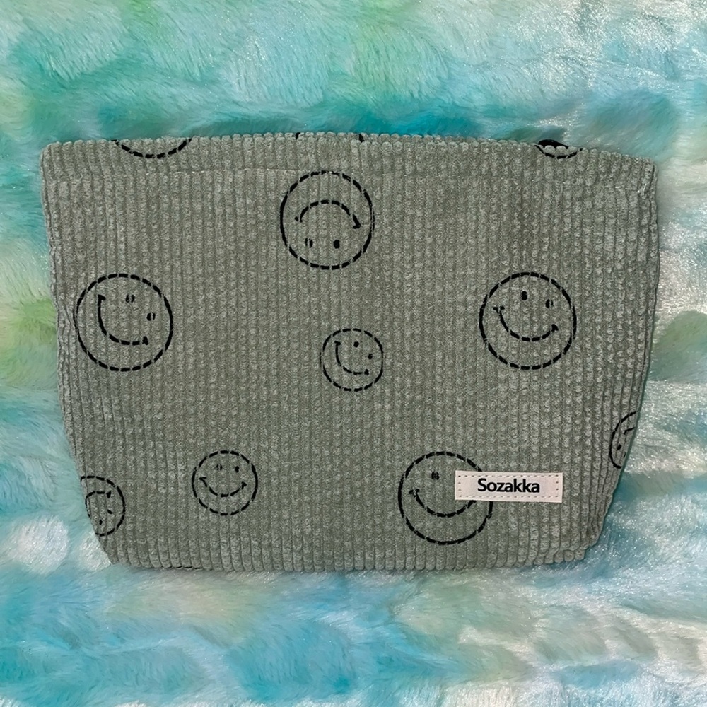 NWOT Sozakka light green cosmetic bag.
